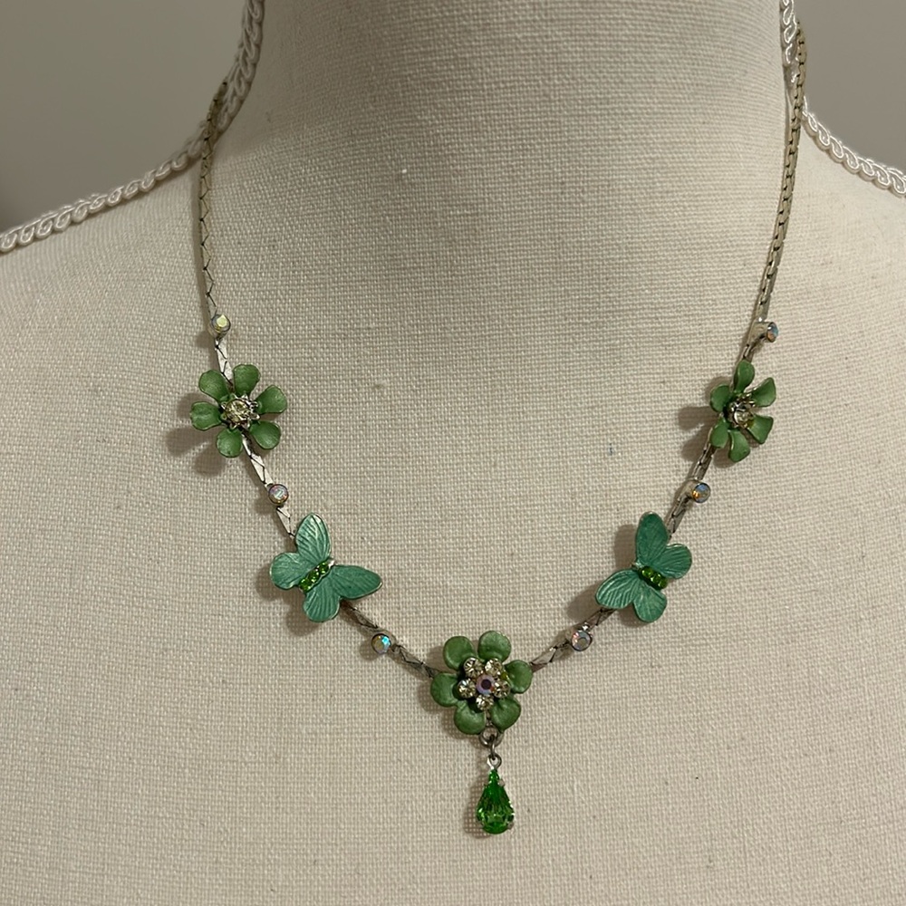 Flowers and butterflies on serpentine chain necklace